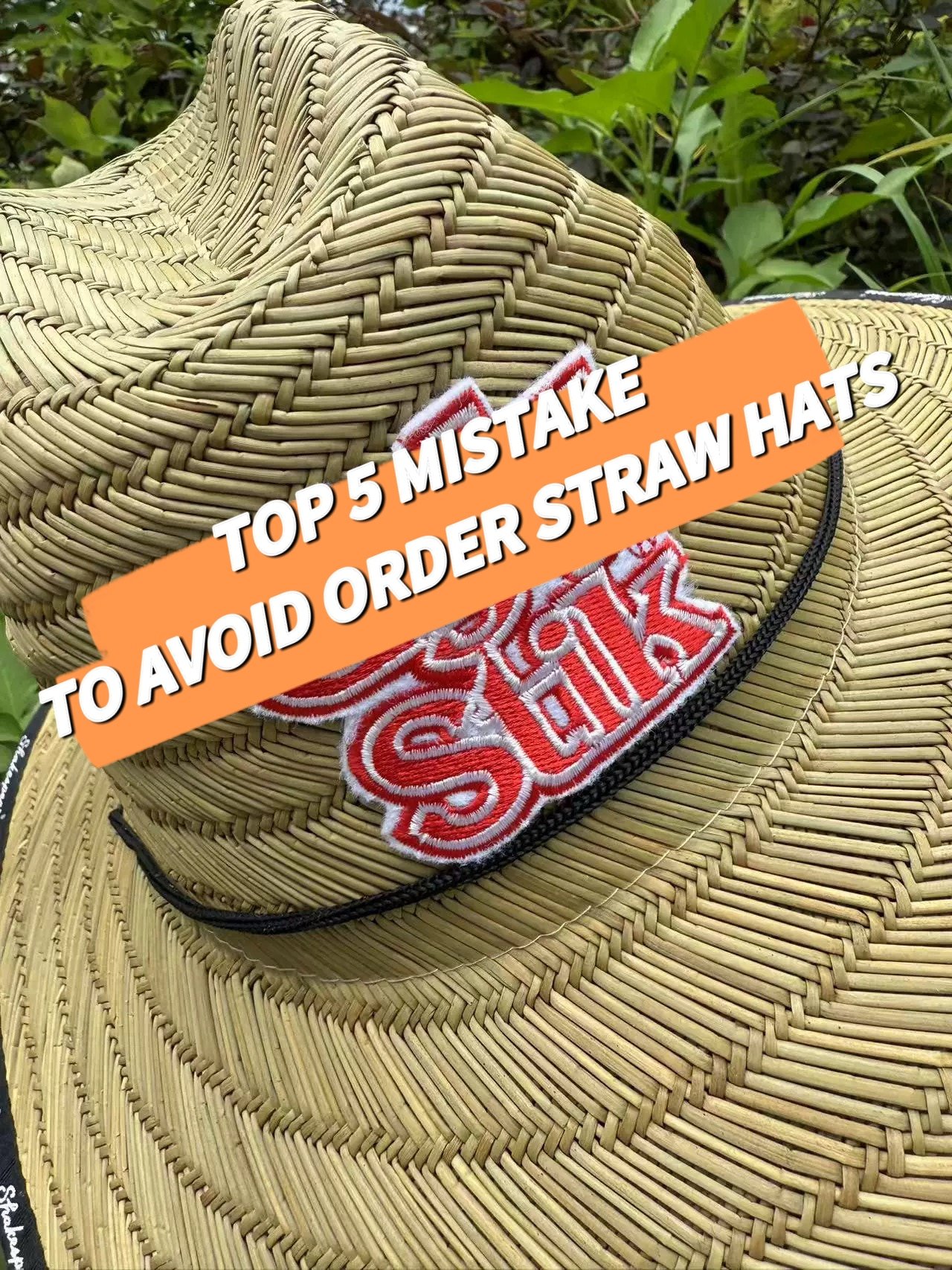 mat straw lifeguard hat in the grass