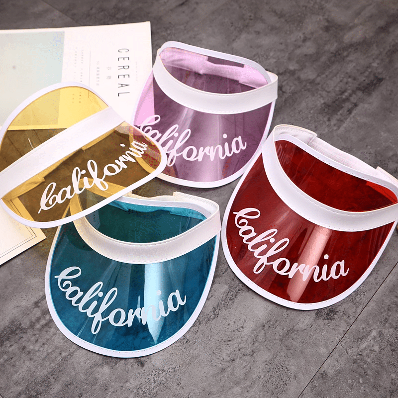 Tinted PVC visors with white trim, festival merch ready for branding.