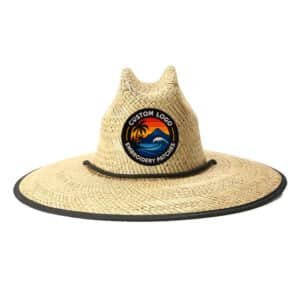 Natural-straw lifeguard hat featuring a tropical embroidery patch, wide brim sun protection; custom logo hats for resort staff & surf retailers.