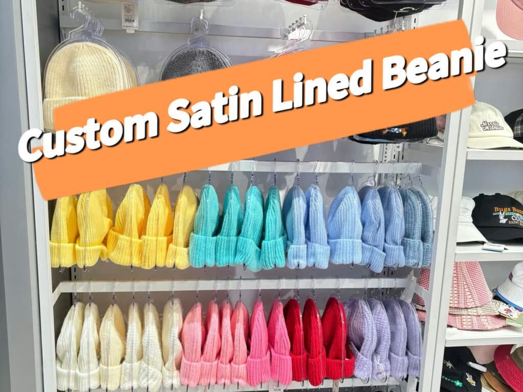 Custom satin lined beanie display—rows of colorful knit hats on store shelves, ready for branding.