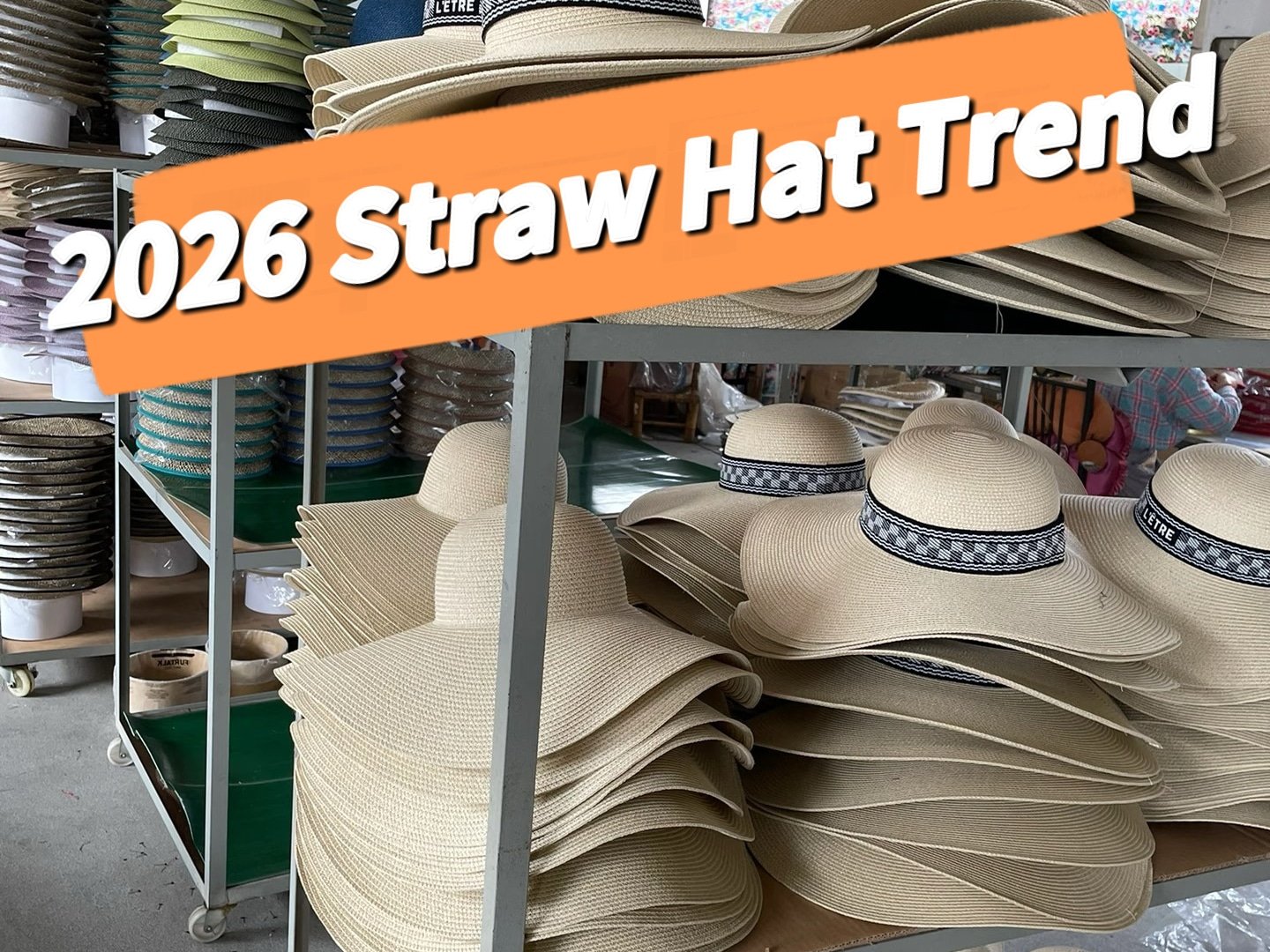 Stacks of wide-brim straw hats in a factory workshop, showing 2026 straw hat trend styles and production details.